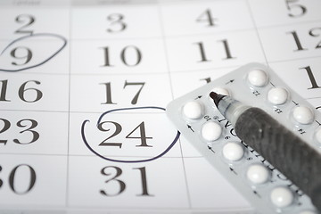 Image showing Birth control pills and pen closeup