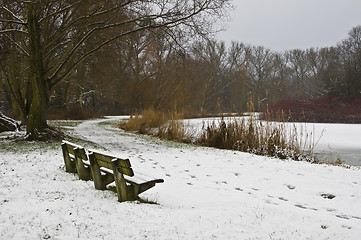 Image showing snowy bench