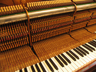 Image showing Old piano being repaired and trimmed.