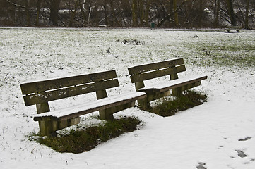 Image showing snowy bench