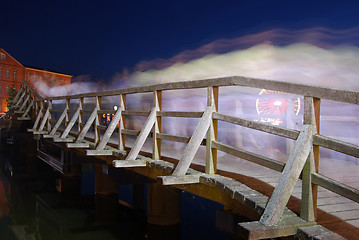 Image showing People crossing a bridge