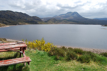 Image showing Picnic table at a beautiful lake