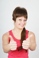 Image showing happy girl with thumbs up