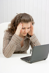 Image showing tired girl with laptop