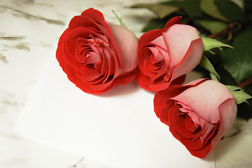 Image showing three red roses and a letter