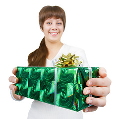 Image showing young woman with a gift on a white background