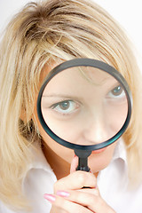 Image showing girl with a magnifying glass