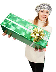 Image showing girl in winter hat gives gift box
