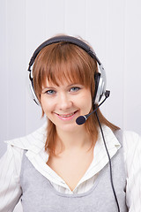 Image showing attractive girl in headphones with microphone