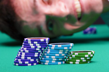 Image showing Chips on the background of a man's face