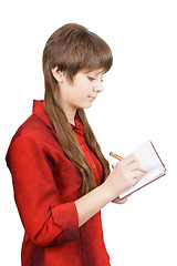 Image showing attractive young woman with pen