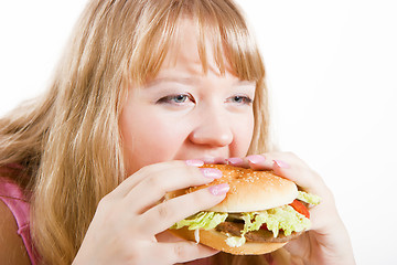 Image showing The young woman and hamburger