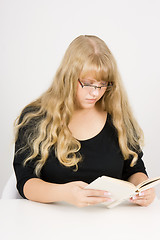 Image showing girl with long hair reads