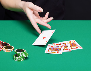 Image showing female hand with a winning card combinations