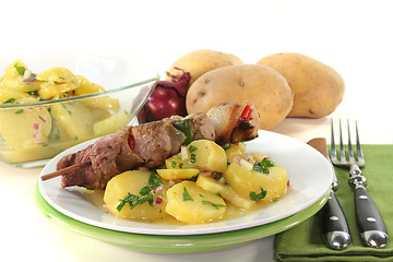 Image showing Shashlik skewer with potato salad