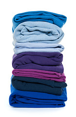 Image showing Pile of blue and purple folded clothes
