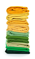 Image showing Pile of green and yellow folded clothes