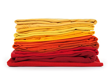 Image showing Red and yellow folded clothes