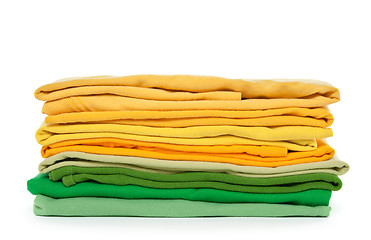 Image showing Green and yellow folded clothes