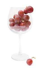Image showing red grapes in a wine glass