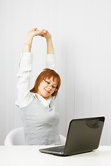 Image showing tired girl with a laptop