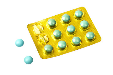 Image showing Set of green pills isolated on white 