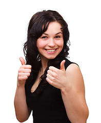 Image showing Young woman showing thumb up gesture