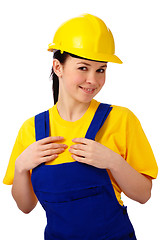 Image showing Young beautiful woman in construction uniform