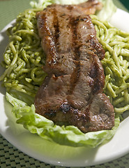 Image showing green spaghetti tallarin saltado steak Peruvian food