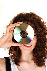 Image showing Girl looking through a disk.