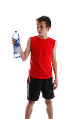 Image showing Teenager holding large bottle of water