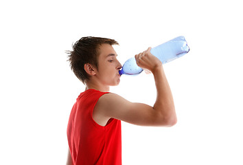 Image showing Boy teen drinking bottled water