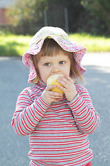 Image showing Little girl with apple