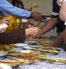 Image showing Incense sticks, lotus flower and money at a temple in Thailand