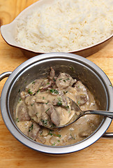Image showing Serving stroganoff and rice