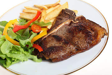 Image showing steak with salad and fries