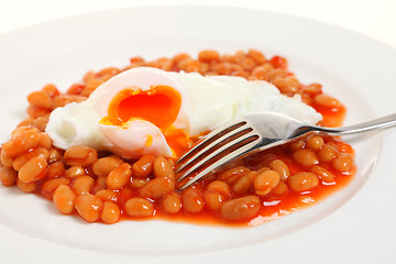 Image showing Egg and beans with fork