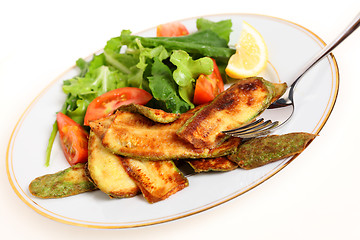 Image showing Fried courgette slices and salad