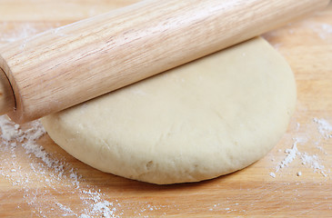 Image showing Rolling pizza dough