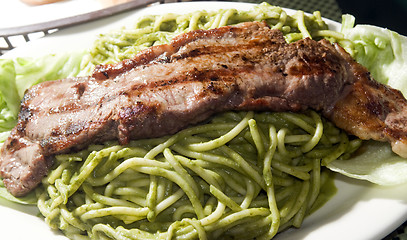 Image showing green spaghetti tallarin saltado steak Peruvian food