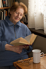 Image showing old woman reading