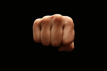 Image showing A man´s fist isolated on black background