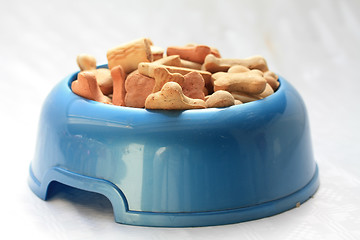 Image showing Dog bowl with dog cookies