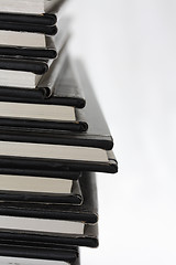 Image showing Stack of black equal books