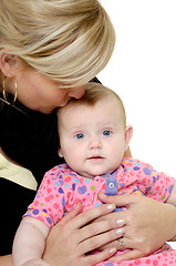 Image showing Mother is kissing baby