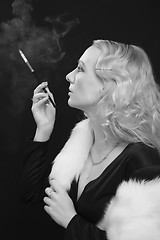 Image showing retro style shot - lady smoke cigarette