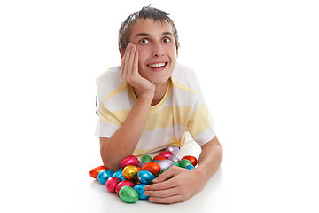 Image showing Boy with easter eggs and looking up
