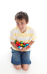 Image showing Boy holding lots of easter eggs