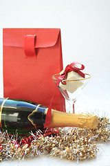 Image showing Christmas gifts and champagne