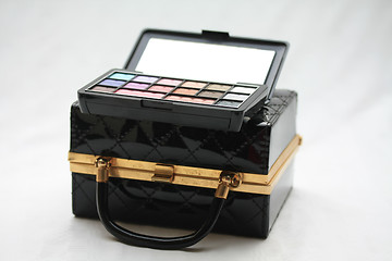 Image showing Handbag and make up kit